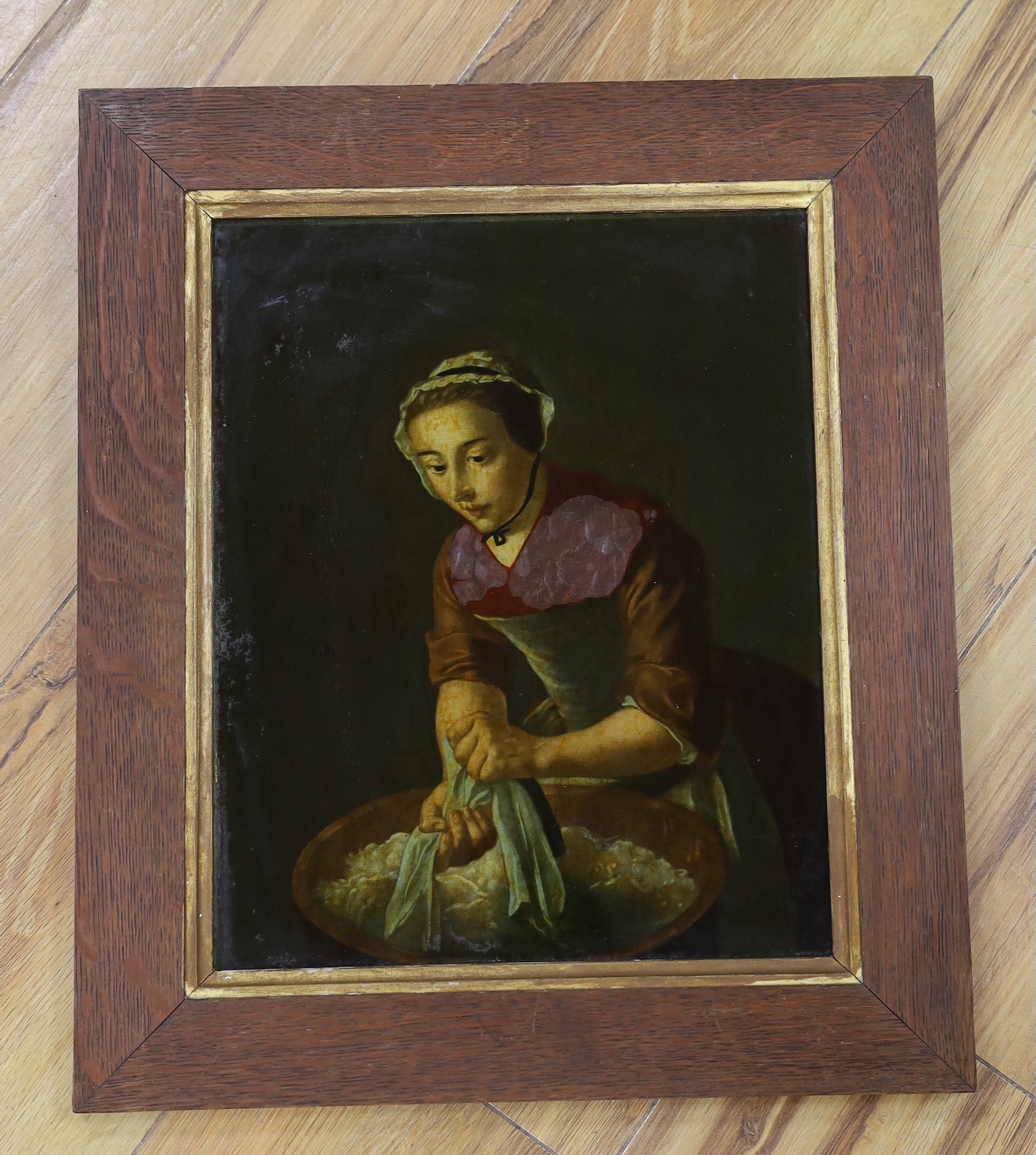 English School, 19th century, reverse glass painted print, painting of a washer woman, dated 1847 verso, 31 x 25cm